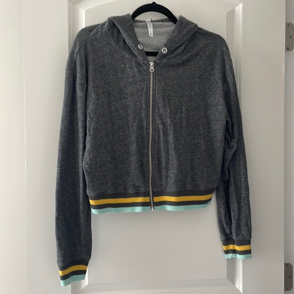 Live laugh love lightweight sweater in grey with yellow/teal stripped details.
